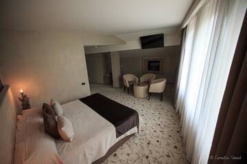 Фото номера Полулюкс Курортные отели Alpin Resort Hotel г. Пояна-Брашов 3