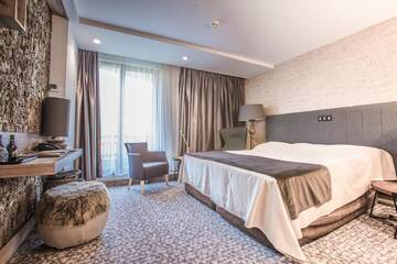 Фото номера Двухместный номер Делюкс с 1 кроватью Курортные отели Alpin Resort Hotel г. Пояна-Брашов 3