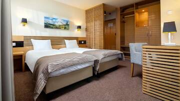 Фото номера Двухместный номер с 2 отдельными кроватями Отель Ana Hotels Sport Poiana Brasov г. Пояна-Брашов 3